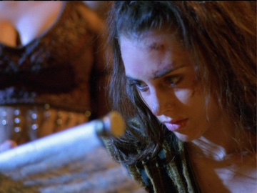 Eve reading about her mother, Xena, in Gabrielle's scrolls